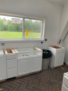 Cabinet install west window/sink area